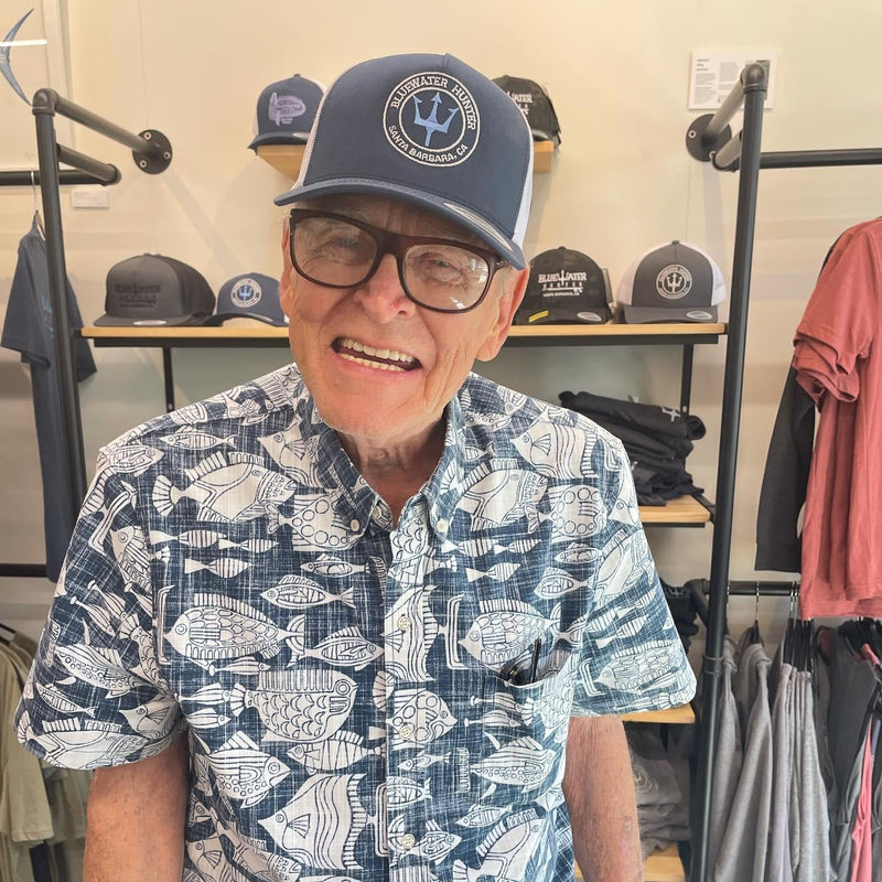 Mal Wolfe, visiting his old dive shop and upgrading his headwear.